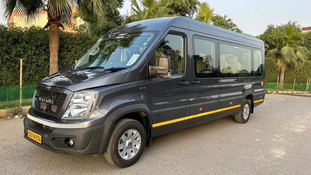 Grey luxury tempo traveller front view